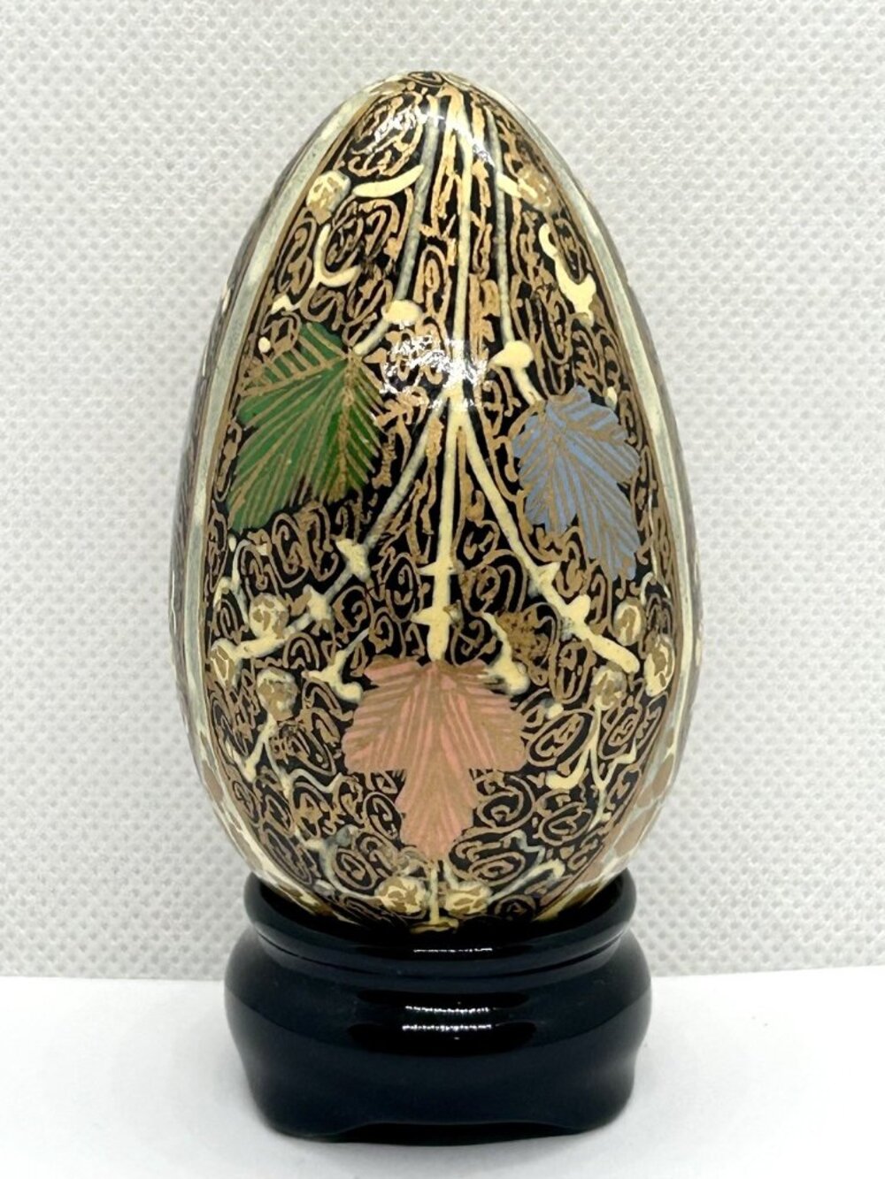Egg ceramic porcelain decorateed with leaves and gold patterns